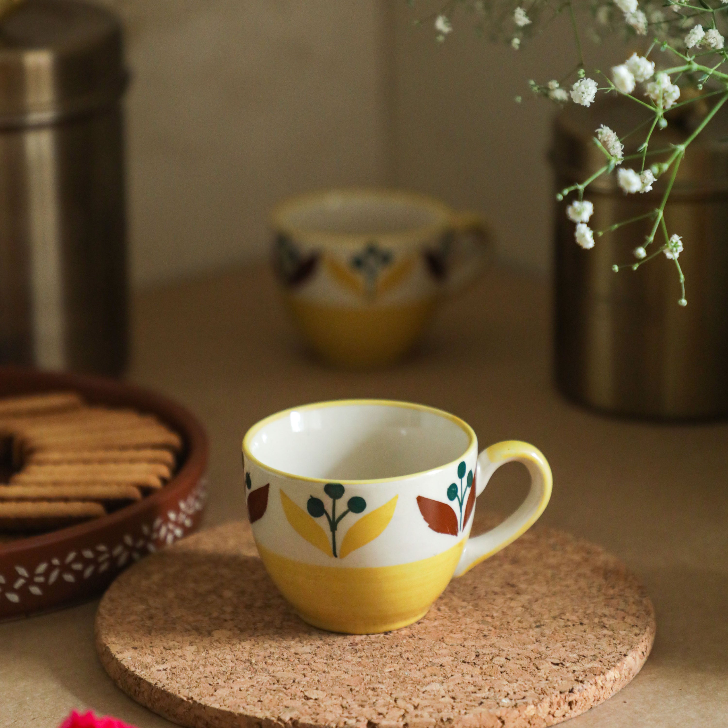 a beautiful printed flower on the outer surface of the tea cups